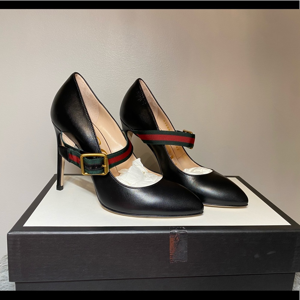 Size 36 black Gucci heels with strap across
